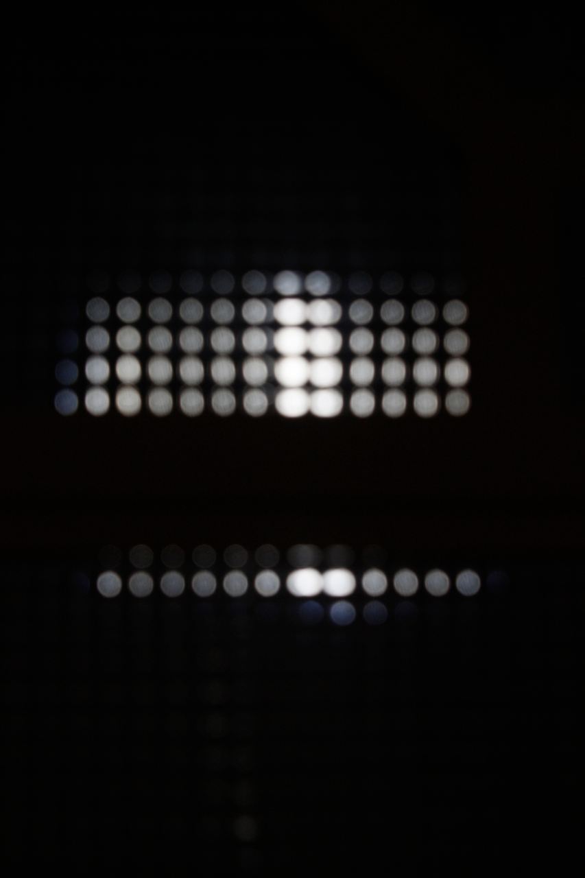 Rows of small lights glowing in the dark